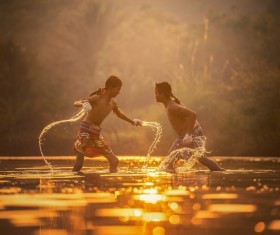 In the small river practicing Muay Thai boy Stock Photo 01