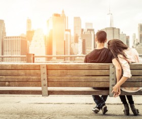 Intimate couple on the bench on the street Stock Photo