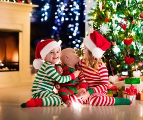 Kids happy before the Christmas tree Stock Photo 03