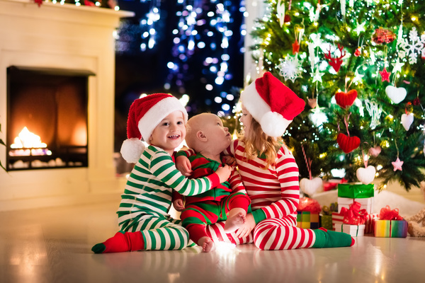 Kids happy before the Christmas tree Stock Photo 03