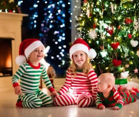 Kids happy before the Christmas tree Stock Photo 04