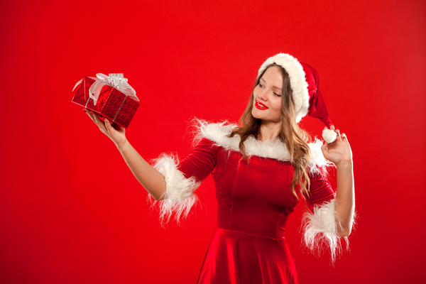 Lady wearing christmas costume holds gift box Stock Photo 06