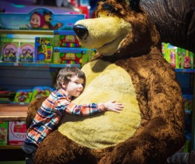 Little boy hugging teddy bear Stock Photo