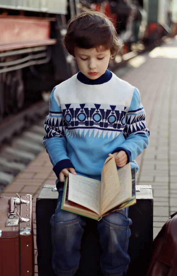 Little boy reading book Stock Photo