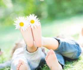 Little feet and flowers Stock Photo