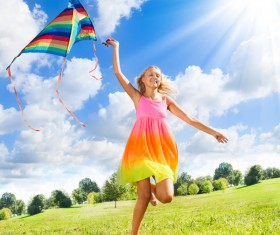 Little girl flying kite Stock Photo