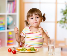 Little girl having lunch Stock Photo