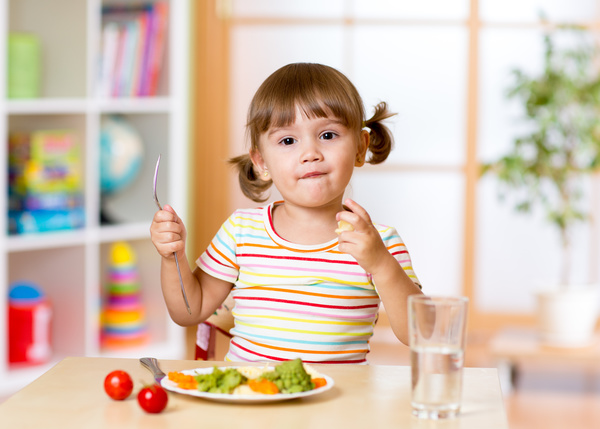 Little girl having lunch Stock Photo