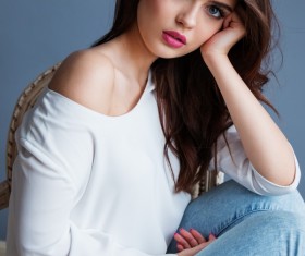 Makeup girl sitting on chair Stock Photo