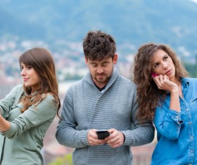 Man and woman using smartphone Stock Photo