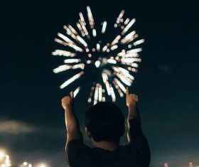 Man watching fireworks Stock Photo