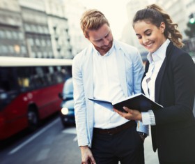 Men and women looking documents Stock Photo