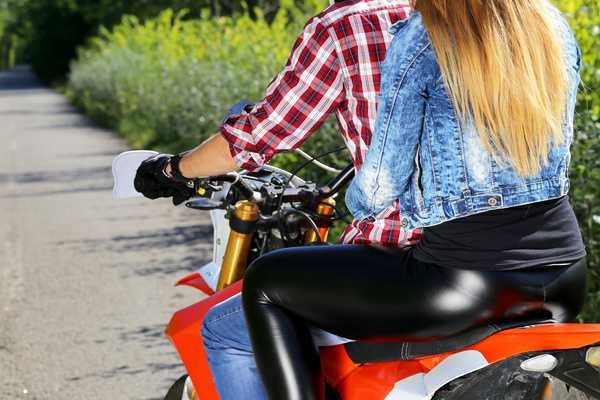 Men and women riding motorcycle Stock Photo