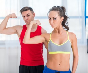 Men and women show biceps Stock Photo
