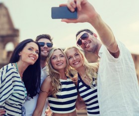 Men and women taking photos with smartphones Stock Photo 03