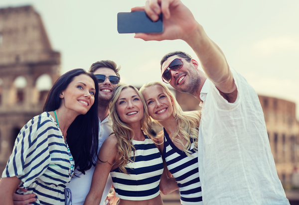 Men and women taking photos with smartphones Stock Photo 03