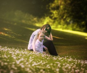 Mother playing with her daughter outdoors Stock Photo