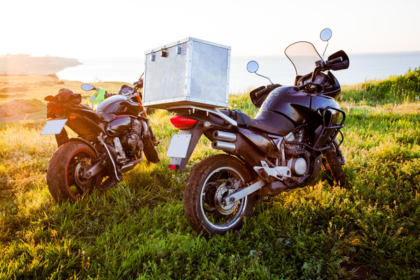 Motorcycles parked on the grass Stock Photo