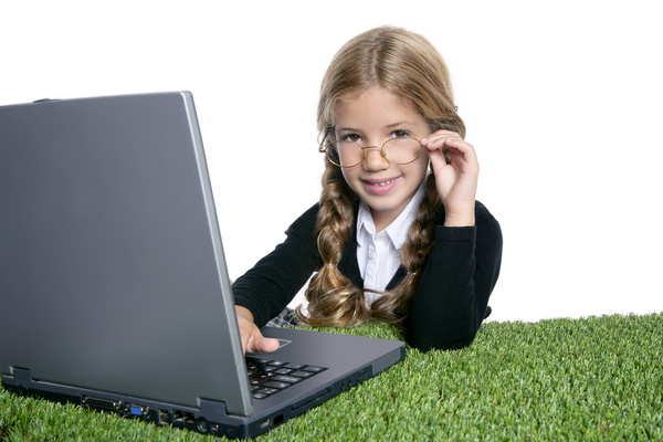 Play computer Lovely lively girls Stock Photo