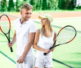 Playing tennis couple Stock Photo