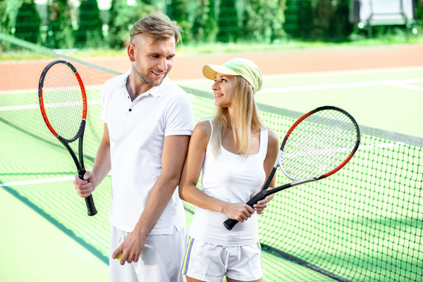 Playing tennis couple Stock Photo