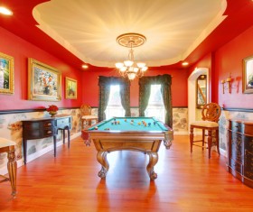 Pool table and oil painting on the wall Stock Photo