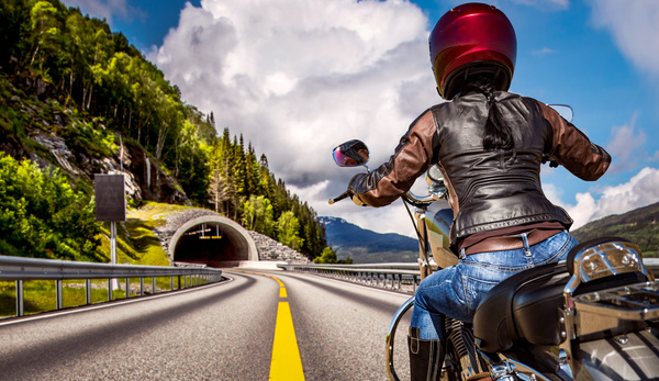 Riding motorcycle woman Stock Photo