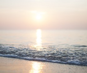 Ripple wave on beach at sunset Stock Photo