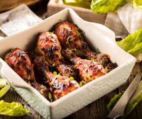 Roasted chicken legs packed in food boxes Stock Photo