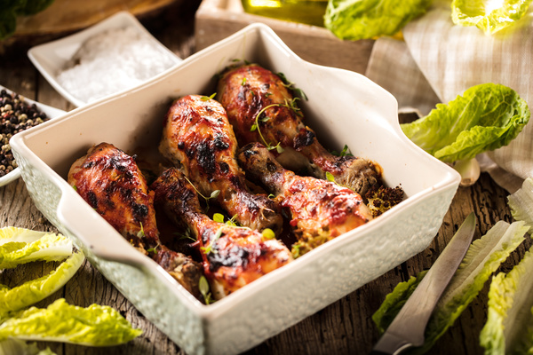 Roasted chicken legs packed in food boxes Stock Photo