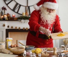 Santa Claus makes food Stock Photo