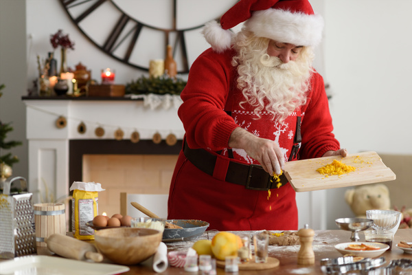 Santa Claus makes food Stock Photo