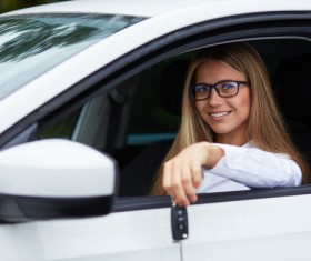 Sitting in the car holding car keys girl Stock Photo 02