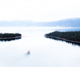 Small boat on beautiful calm bay Stock Photo