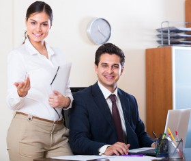 Smiling boss with secretary Stock Photo 01