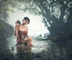 Southeast Asia girl bathing in the river Stock Photo 01