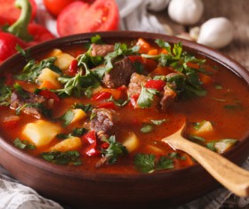 Stewed meat and beans in tomato sauce with greens Stock Photo 01