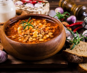 Stewed meat and beans in tomato sauce with greens Stock Photo 02