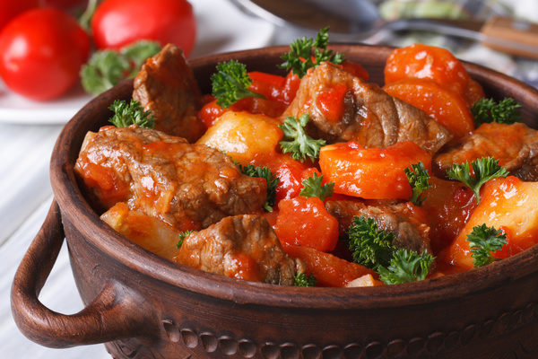 Stewed meat and beans in tomato sauce with greens Stock Photo 04