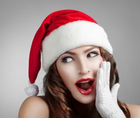 Surprised girl wearing christmas hat Stock Photo