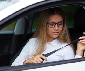 Wear seatbelt ready to drive woman Stock Photo 01
