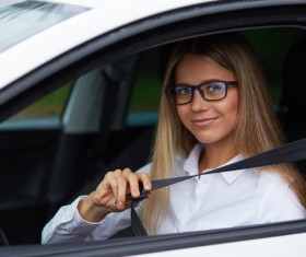 Wear seatbelt ready to drive woman Stock Photo 02