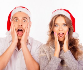 Wearing Christmas hat exaggerated facial expressions couples Stock Photo 02