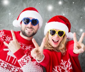 Wearing Christmas hat exaggerated facial expressions couples Stock Photo 03