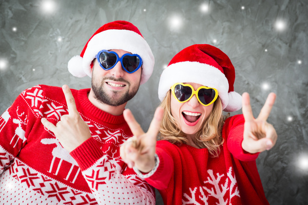 Wearing Christmas hat exaggerated facial expressions couples Stock Photo 03