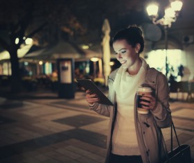 While walking to see the Tablet PC girl Stock Photo