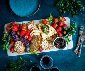 Wine cheese biscuits and berries Stock Photo
