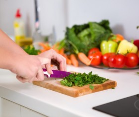 Woman chopping vegetables in the kitchen Stock Photo 02