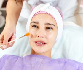 Woman doing facial care Stock Photo