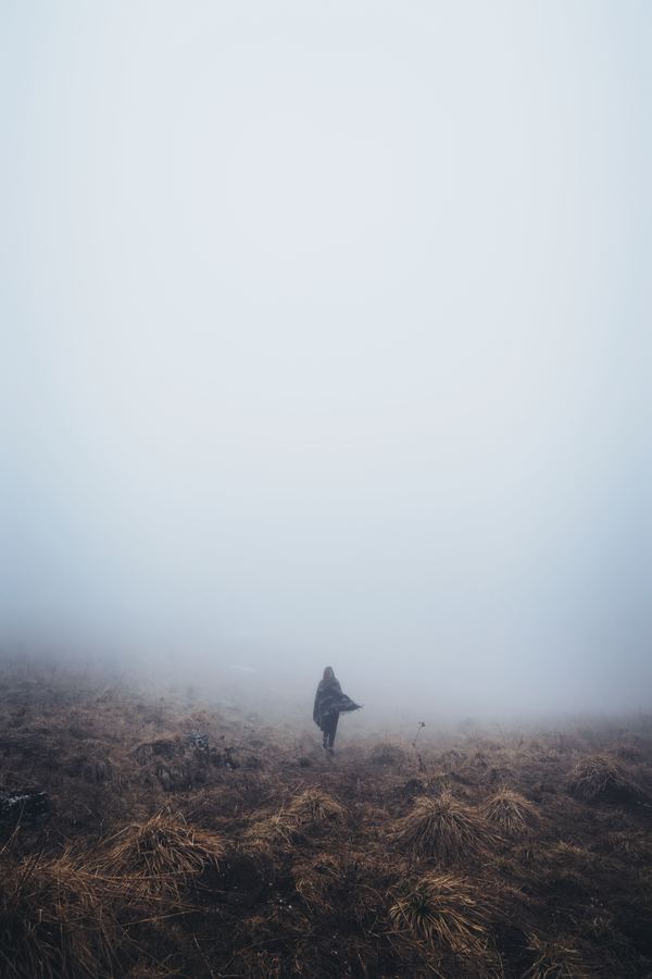 Woman in thick fog Stock Photo